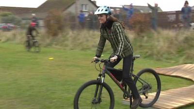 Catherine, Princess of Wales, riding a bike