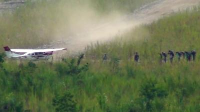 Loading cocaine on to a plane in a remote part of Peru