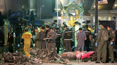 Police investigate the scene at the Erawan Shrine after an explosion in Bangkok