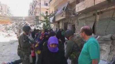 Syrian state media footage purporting to show civilians leaving Aleppo