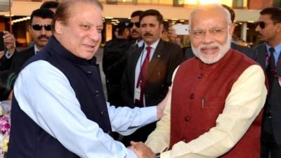 India's Prime Minister Narendra Modi (right) shakes hands with his Pakistani counterpart Nawaz Sharif (left) in Lahore