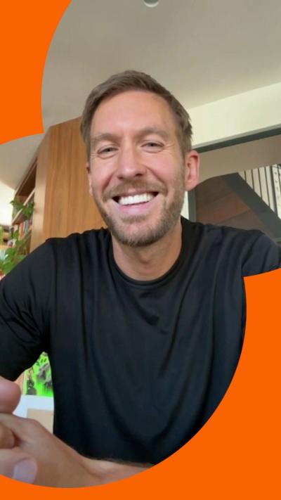Calvin Harris smiling at the camera 