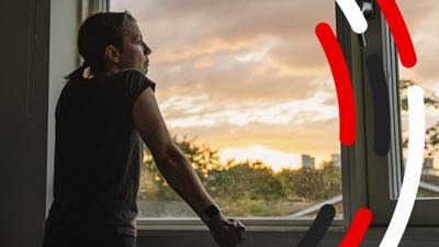 Woman looking out of a window