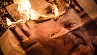 Image of Fethullah Gulen which has been set on fire