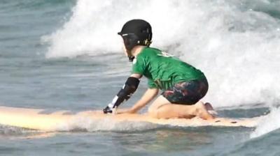 Image of young girl using the Nicole tool whilst surfing