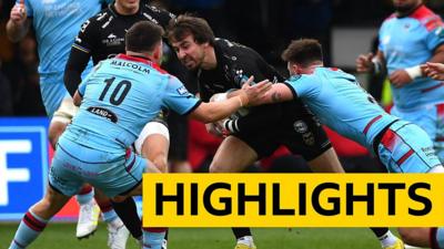 Rhodri Williams of Dragons is tackled by Ali Price of Glasgow in the United Rugby Championship