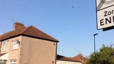 A plane flying over Francis Road in Hounslow