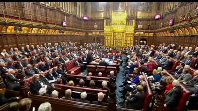 Peers sit in a full House of Lords