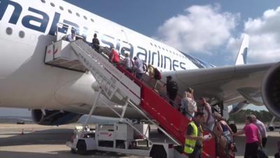 Passengers boarding a plane