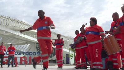 Watch the street cleaners of Rio, Brazil, celebrate their National Day by parading and dancing through the streets