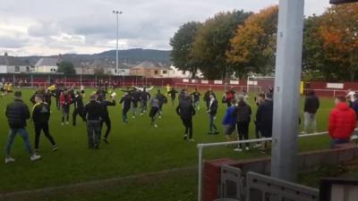 Celebration on the pitch after Ynysddu Welfare youth football team won their first official match