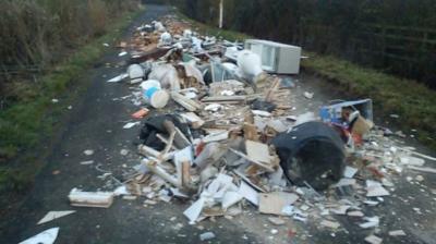 Fly-tippers have left a Bedfordshire road littered with rubbish, including a toilet, a bathtub and a fridge.