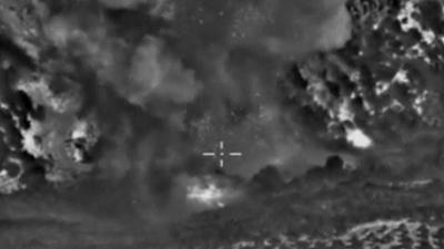 Screen grab of Russian Defence Ministry footage, purportedly showing smoke rising after airstrikes on the Islamic State near Jisr al-Shughour in Idlib province
