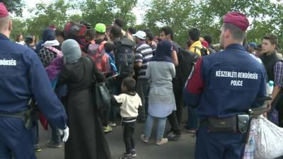 Refugees and police at the border