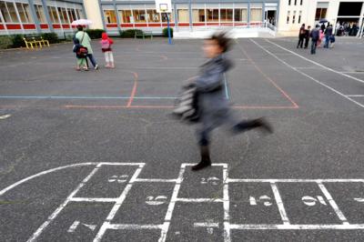 Girl playing hopscotch