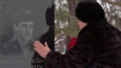 Raisa at her son's grave