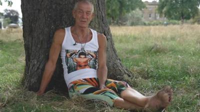 Michael Peacock walks the streets of Lewisham barefoot. He says it makes him feel grounded and helps with his well-being.