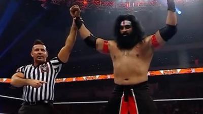 Veer Mahaan celebrates winning his match over Rey Mysterio