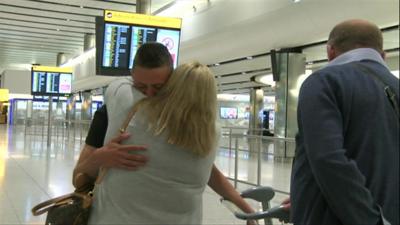 Jac Holmes greets his parents