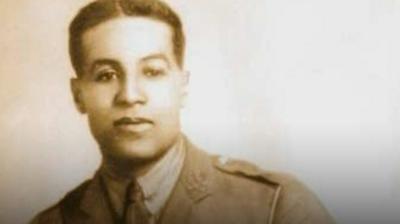 The Northampton Town manager went to France to see where former player Walter Tull died in battle.