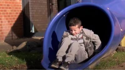 Hassan on slide