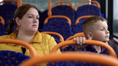 Mother and son on the bus