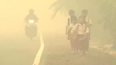 Children walking in haze