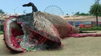 Dead whale made out of plastic waste