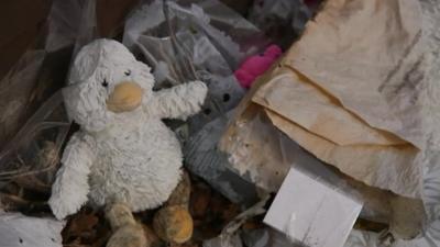 A toy with flowers left outside the house where Keegan Downer died