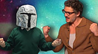 Child in homemade Mandalorian helmet and Pedro Pascal.