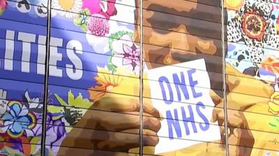 A new mural in east London mural is four storeys high, created with more than 200 flowers.