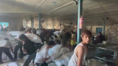 Chaos at Gaza aid centre as people grab supplies after break-in