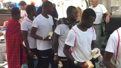 Migrants receiving food on Aquarius