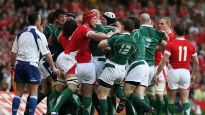 Wales and Ireland clash early on during their final match of the 2009 Six Nations Championship.