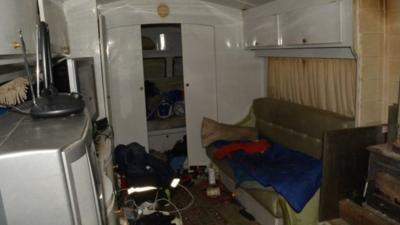 Squalid conditions in a caravan