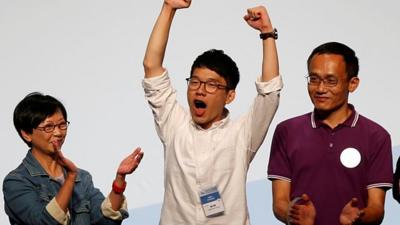 Nathan Law celebrates his win in Hong Kong's legislative council elections.