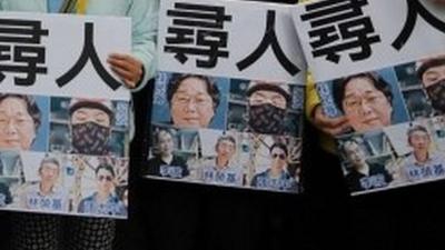 Protesters holding signs in Hong Kong