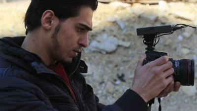 Journalist films in Aleppo