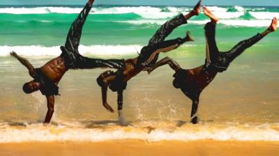 Breakdancer on a beach in Senegal