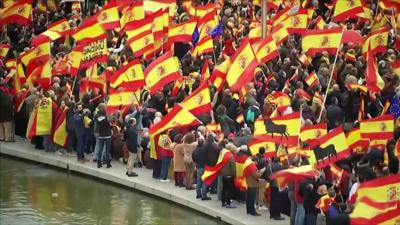 crowds with Spanish flags