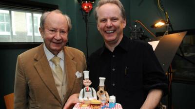 Actor Peter Sallis (L) gets birthday cake from film maker Nick Park