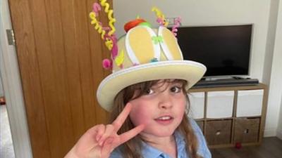 Girl in Easter bonnet.
