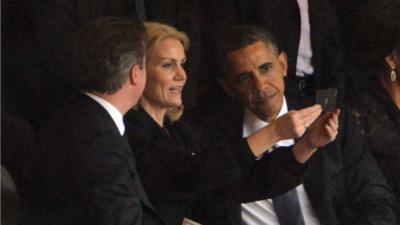 Danish Prime Minister Helle Thorning Schmidt takes a selfie with Barack Obama and David Cameron