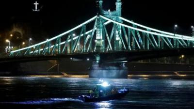 A rescue team scours the Danube for survivors after a tourist boat capsized