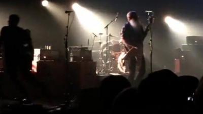 Band on stage at Bataclan venue as first shots are fired