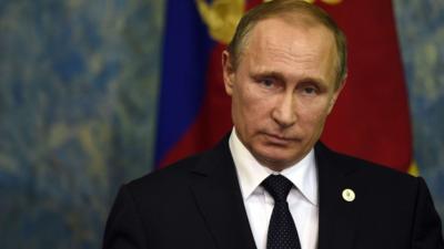 Russian President Vladimir Putin holds a press conference, on 30 November 2015, during the COP21 United Nations conference on climate change in Paris.