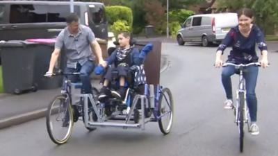 Lewis and family on their trike