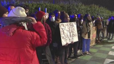 Protesters holding banners