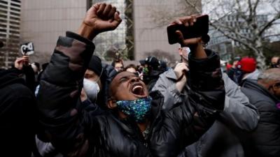 Person reacts to Chauvin verdicts outside court