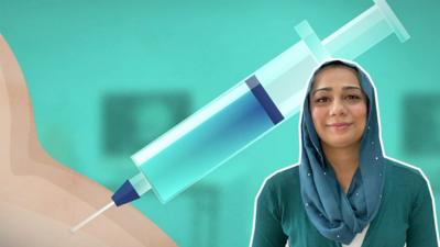 Dr Nighat Arif in front of a vaccine graphic